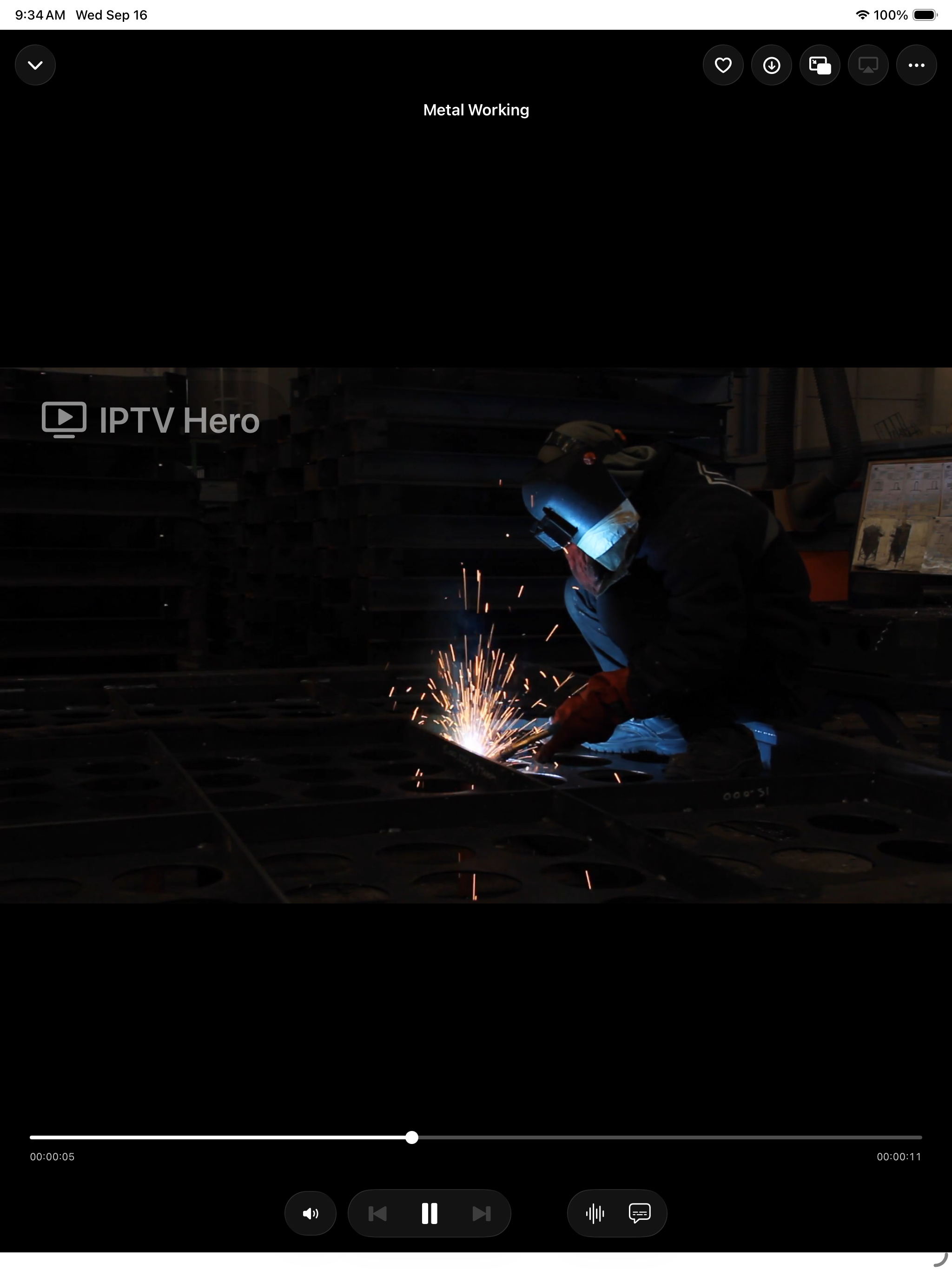 IPTV Hero on iPad playing a live channel, with the seek bar and playback controls below the video.