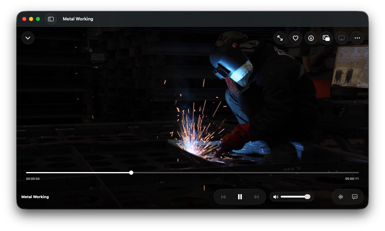 IPTV Hero on Mac playing a live channel, with the seek bar and playback controls overlaid on the video.